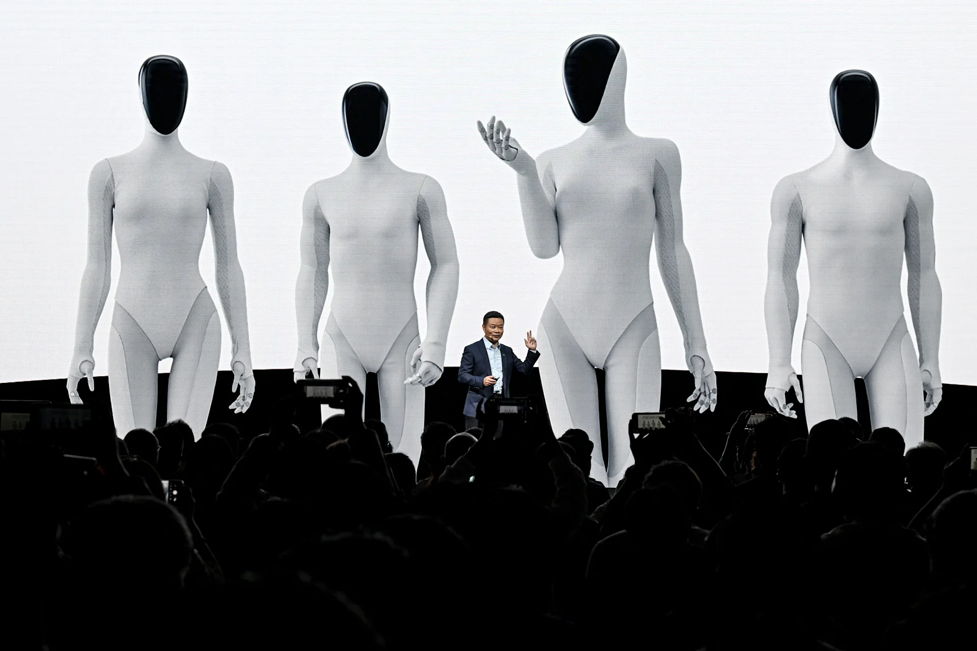 He Xiaopeng, cofounder and chairman of Chinese electric vehicle maker Xpeng, launches Xpeng's next-gen Iron humanoid robot during AI Day press conference